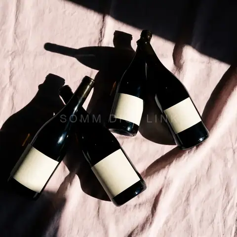 Three bottles on linen