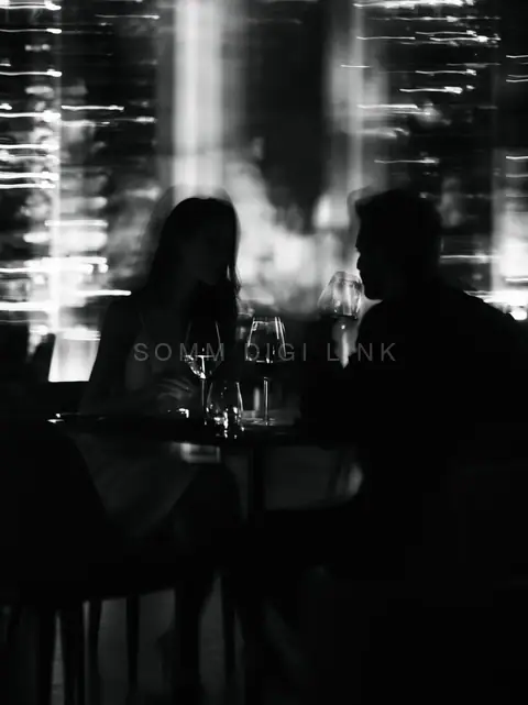 Two glasses, city lights