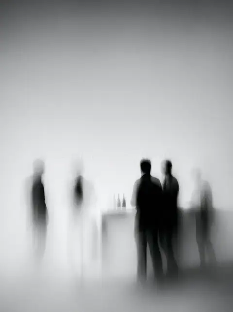 Four figures in white